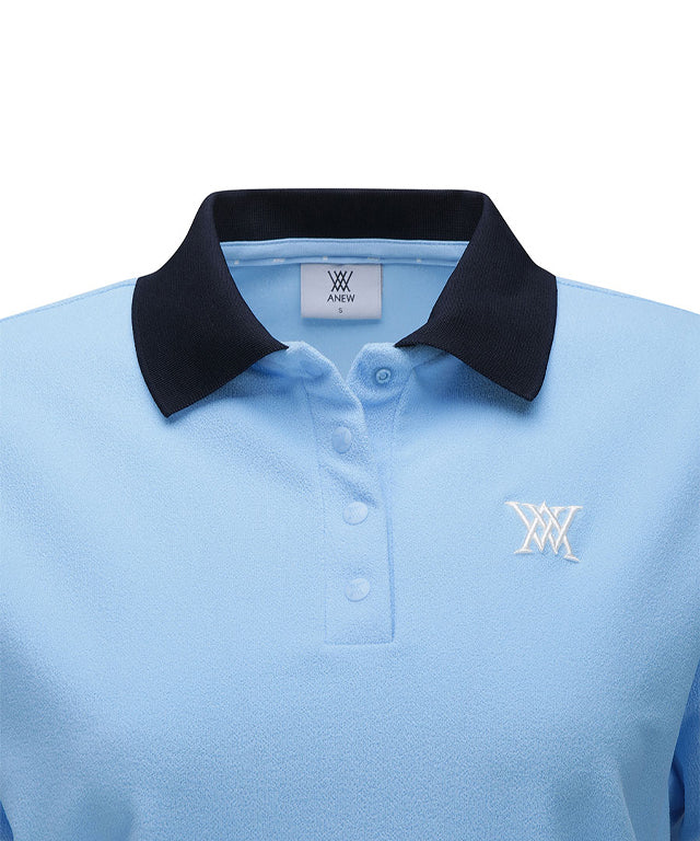 Sky blue women's short t-shirt with terry material collar and color block details, perfect for golf.
